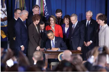 President Barack Obama signs the repeal